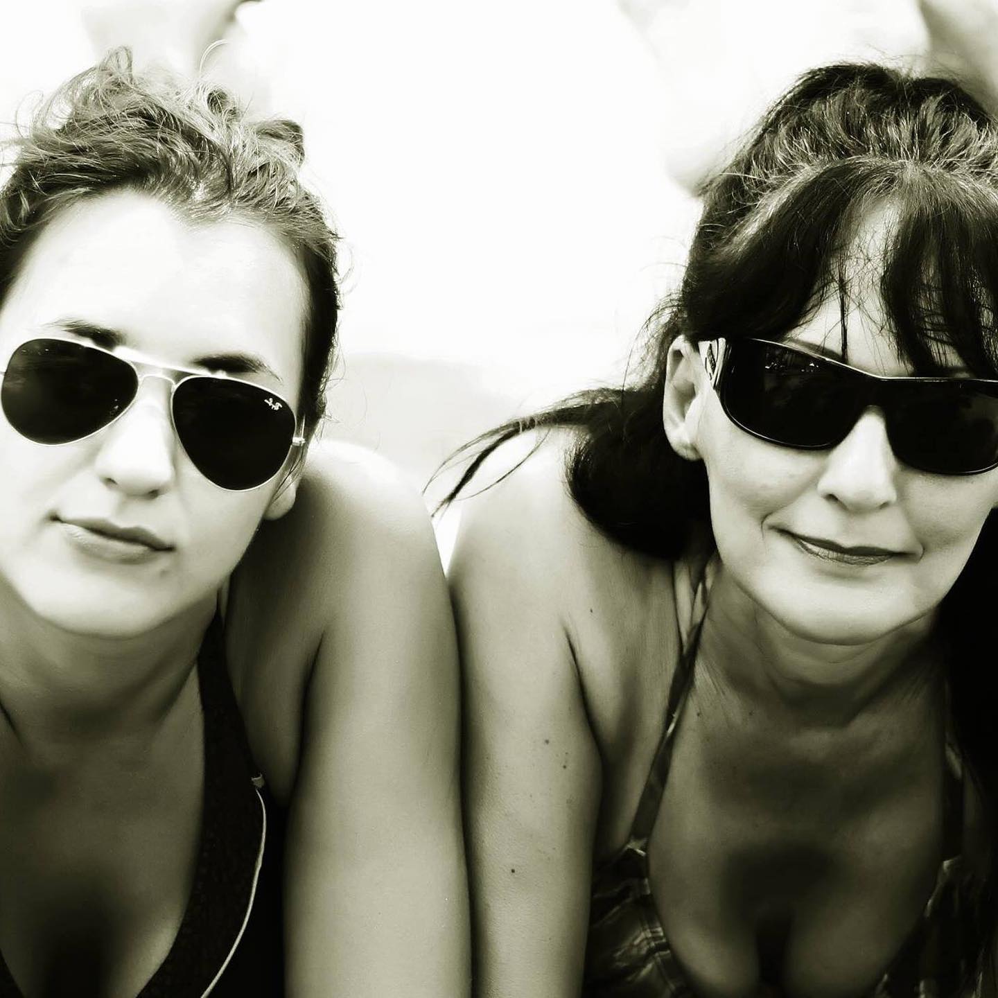 Abi and Dolina in Bali wearing glasses and smiling at the camera